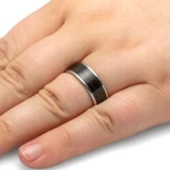 Vinyl Record Ring, Titanium Wedding Band With Vinyl LP Inlay 14 Vinyl Record Ring, Titanium Wedding Band With Vinyl LP Inlay -Johan Jewelry Shop 3838 Handshot