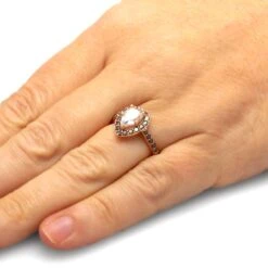 Pear Halo Engagement Ring With Black Diamonds -Johan Jewelry Shop 4486Handshot