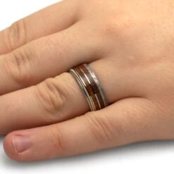 Bass Guitar String Ring With Dinosaur Bone, Meteorite, And Whiskey Wood 10 Bass Guitar String Ring With Dinosaur Bone, Meteorite, And Whiskey Wood -Johan Jewelry Shop 4947Handshot