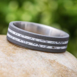 Sandblasted Titanium Wedding Band With Black Stardust™ 19 Sandblasted Titanium Wedding Band With Black Stardust™ -Johan Jewelry Shop E3673VariantCropped 2