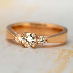 Three Stone Engagement With Floral Prongs
