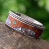 Guitar String Wedding Band With Abalone Wave Design And Emerald Stone 1 Guitar String Wedding Band With Abalone Wave Design And Emerald Stone -Johan Jewelry Shop E4653ArtCropped 3