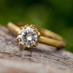 Moissanite Lotus Engagement Ring In Polished Gold Band