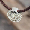 Brown Braided Leather Necklace With Reel Pendant 2 Brown Braided Leather Necklace With Reel Pendant -Johan Jewelry Shop E 4157 Art Cropped 4
