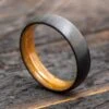 6mm Black Zirconium Ring With Whiskey Barrel Wood Sleeve 1 6mm Black Zirconium Ring With Whiskey Barrel Wood Sleeve -Johan Jewelry Shop Ebzoverwhisk6ArtCropped 3